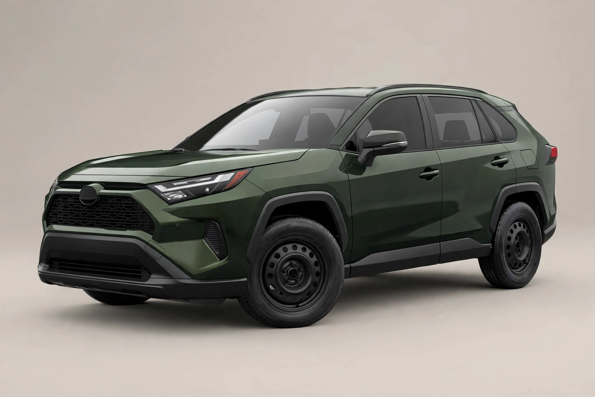 Dark green Toyota RAV4 compact SUV in a studio, front three-quarter view